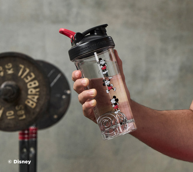 pro-series-p4 Mickey_Mouse_Protein_Shaker_Bottle_Being_Held_In_the_Gym.jpg